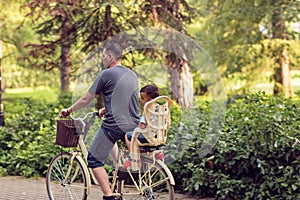 Family cycling outdoors Ã¢â¬â father and son on bicycles in park